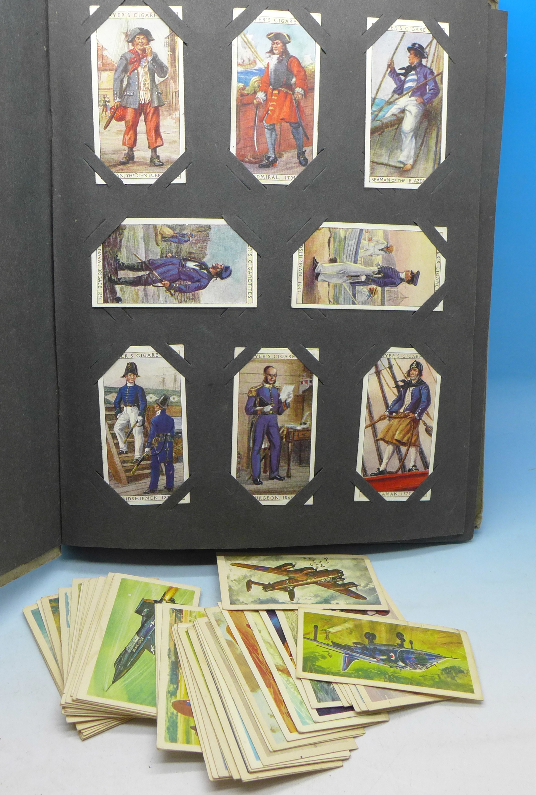 An album of cigarette cards including Players and loose tea cards