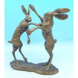 A bronze figure of two fighting hares after P.