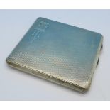 A silver cigarette case, with initials,