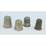 Two silver thimbles including one Victorian and two other thimbles,