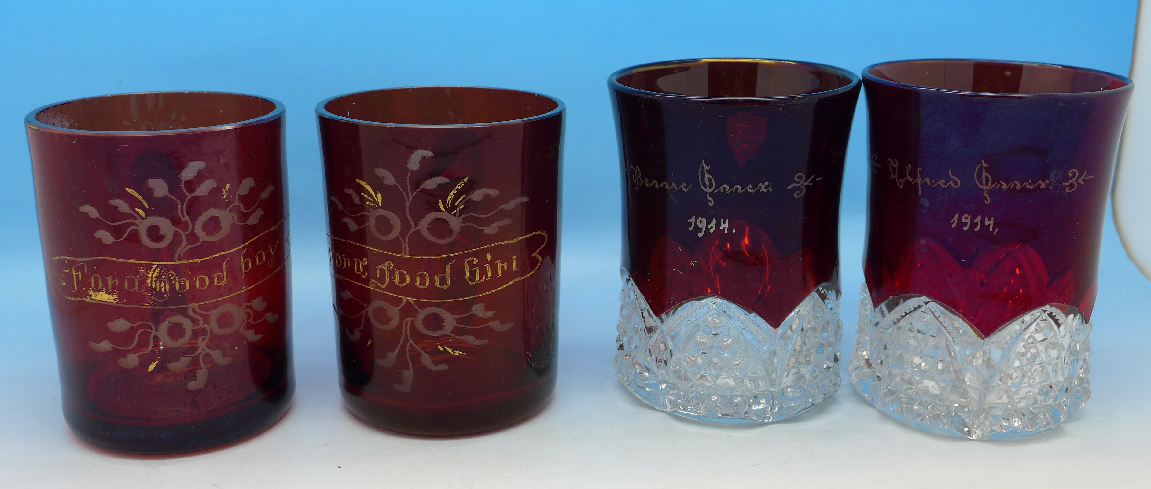 Two pairs of ruby glass mugs,