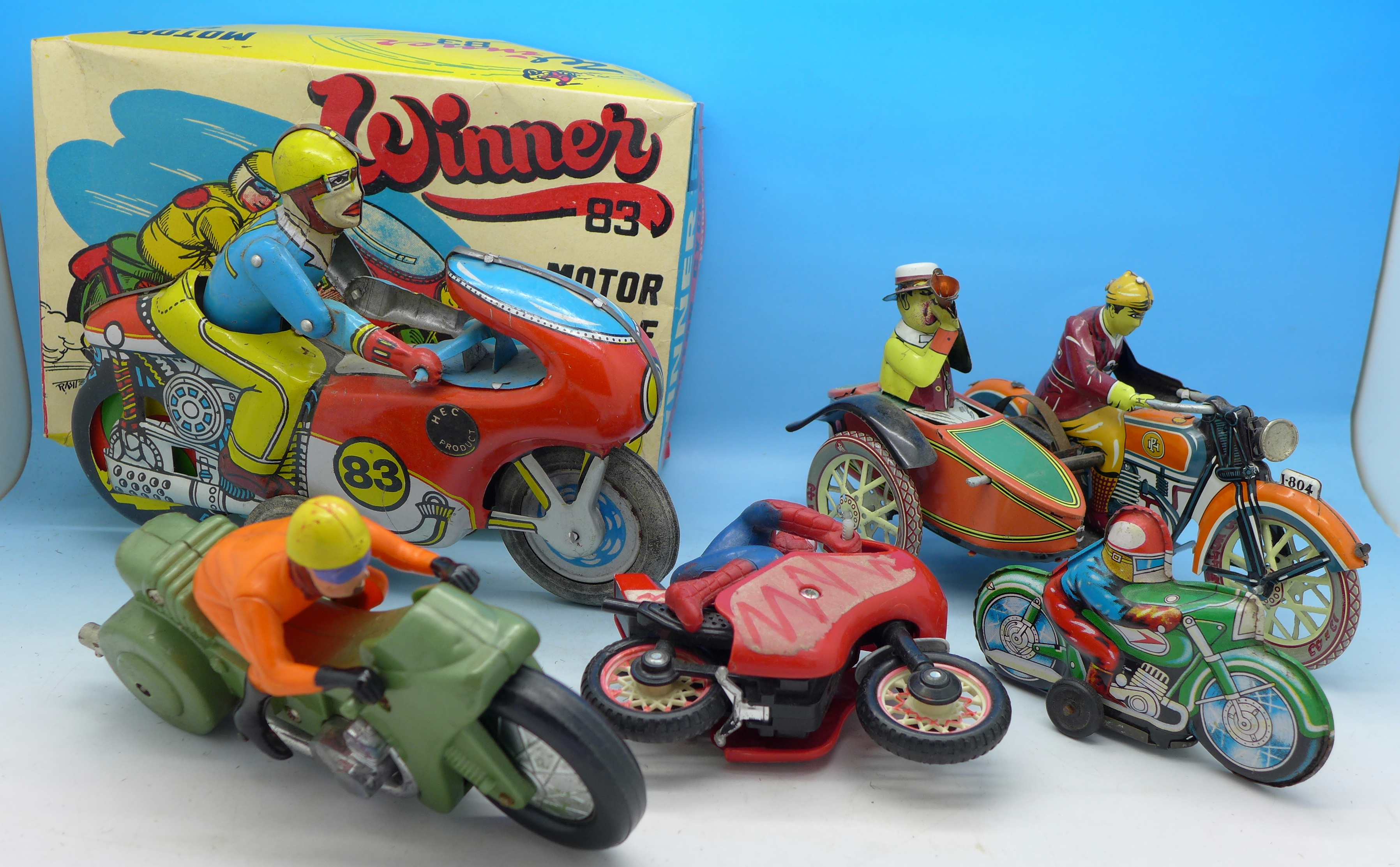 Tin plate and plastic toy motorcycles including Spiderman