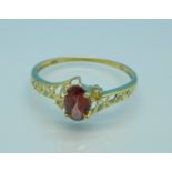 A 9ct gold, garnet and diamond ring, 0.