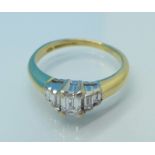 An 18ct gold, five stone baguette diamond ring, total diamond weight 0.40 carats, 3.