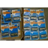 Twenty identical Matchbox double-decker buses,