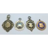 Four silver fobs, one gold fronted,