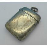 A Victorian silver vesta case, Birmingham 1895, hinge loose,