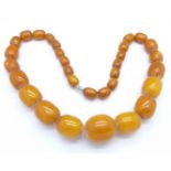 An amber coloured bead necklace