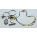 A silver necklet, two silver bangles, a silver marcasite ring,