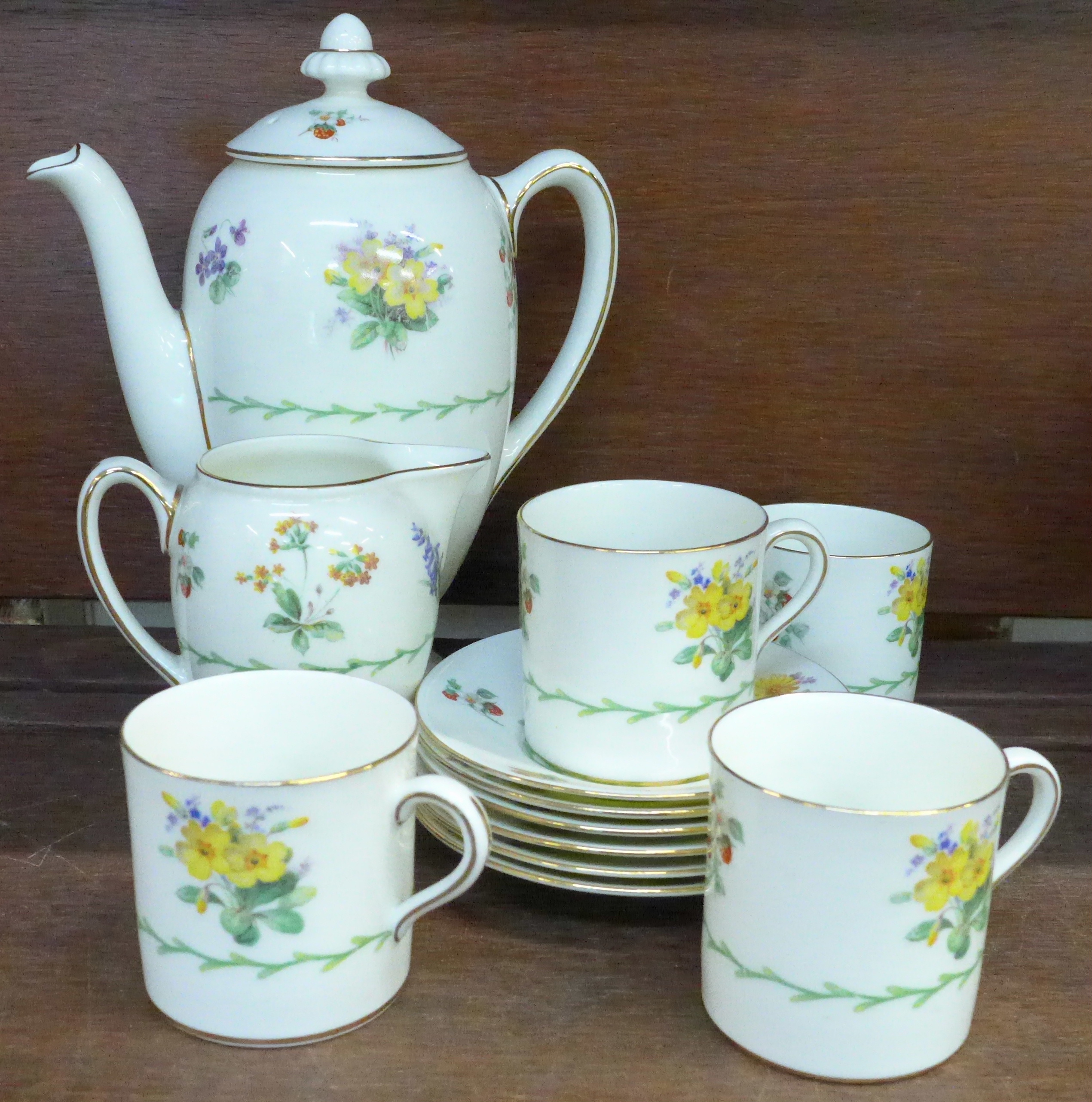 A Royal Doulton six setting coffee set, Wild Flowers, pattern number V1566,