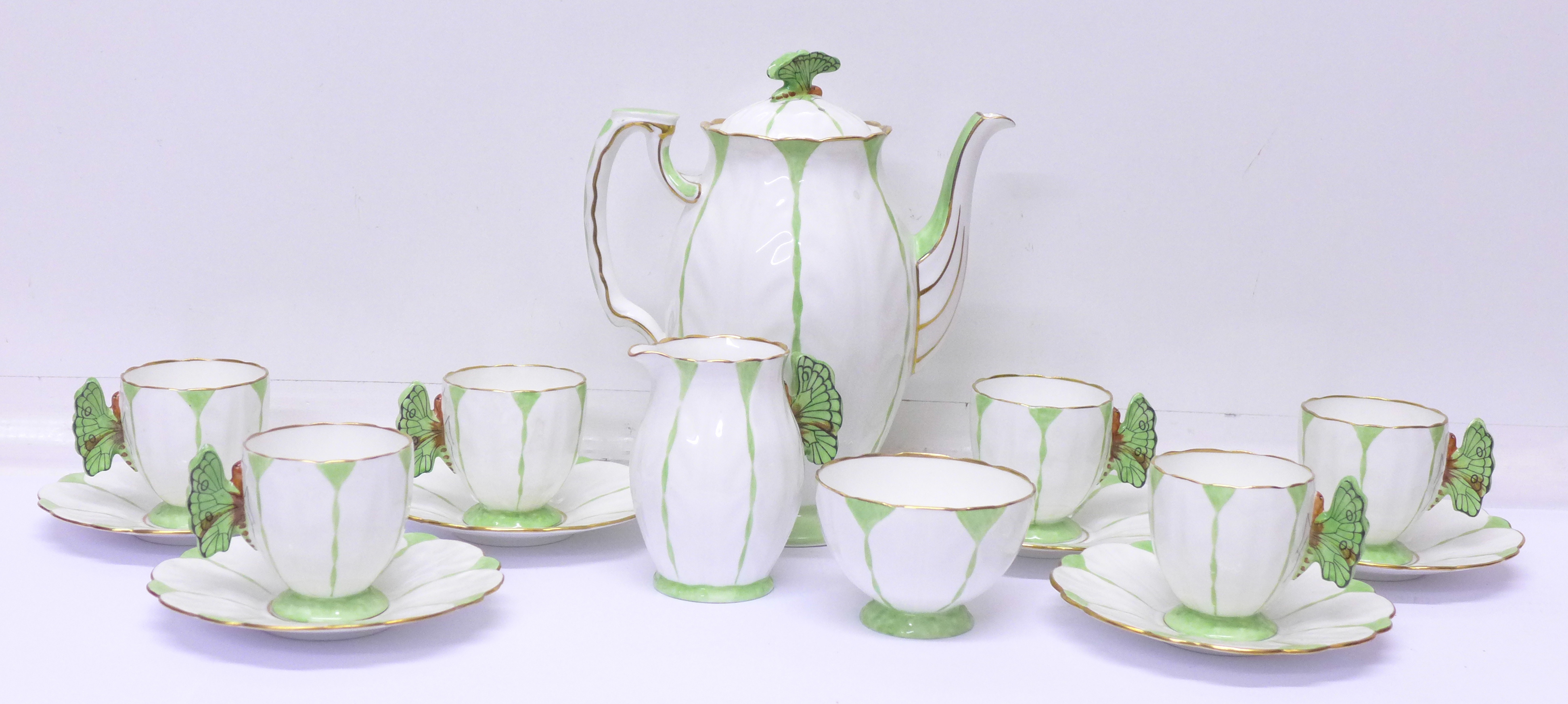 A rare Aynsley Green Harlequin Art Deco butterfly handle six setting coffee set,