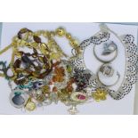 Costume jewellery including carved elephant necklace and amber bracelet