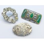 Three silver brooches including one Victorian