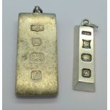 Two silver ingot pendants,