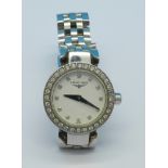 A lady's diamond set Longines bracelet wristwatch