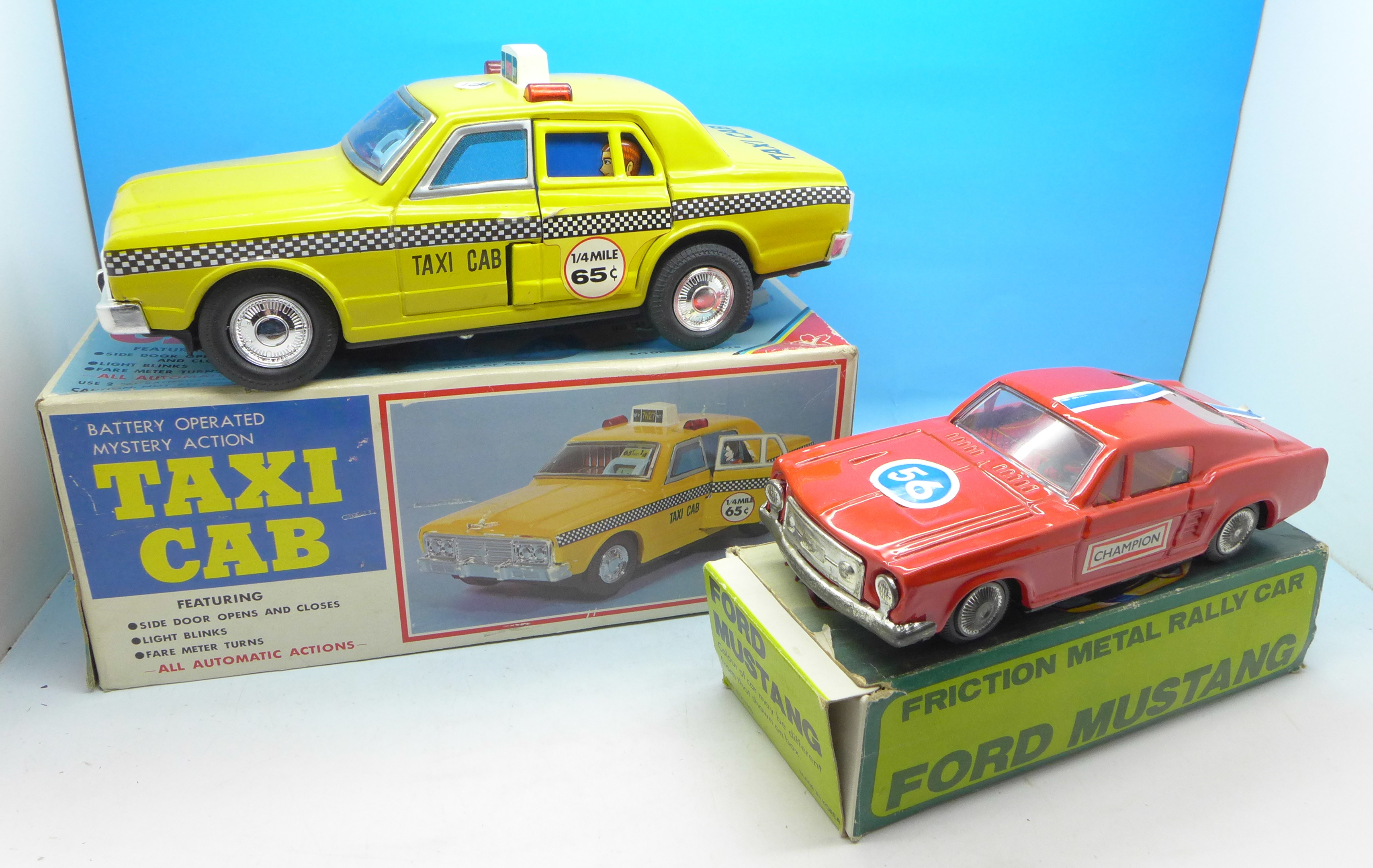 Two 1960's/1970's tin plate vehicles, battery operated taxi cab and friction metal rally car,