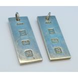 Two silver ingots pendants,