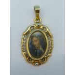 An 18ct gold picture pendant, 1.
