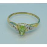 A 9ct gold, peridot and diamond ring, 0.