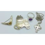 A silver cat brooch, a Celtic silver cross and chain, a brooch and a ring,