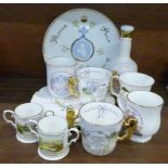 Twelve Royal commemorative pieces of china, including an empty Wade bell decanter,