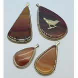 Four silver and agate pendants,