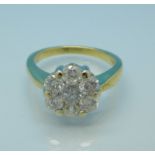 An 18ct gold, seven stone diamond cluster ring, 5.