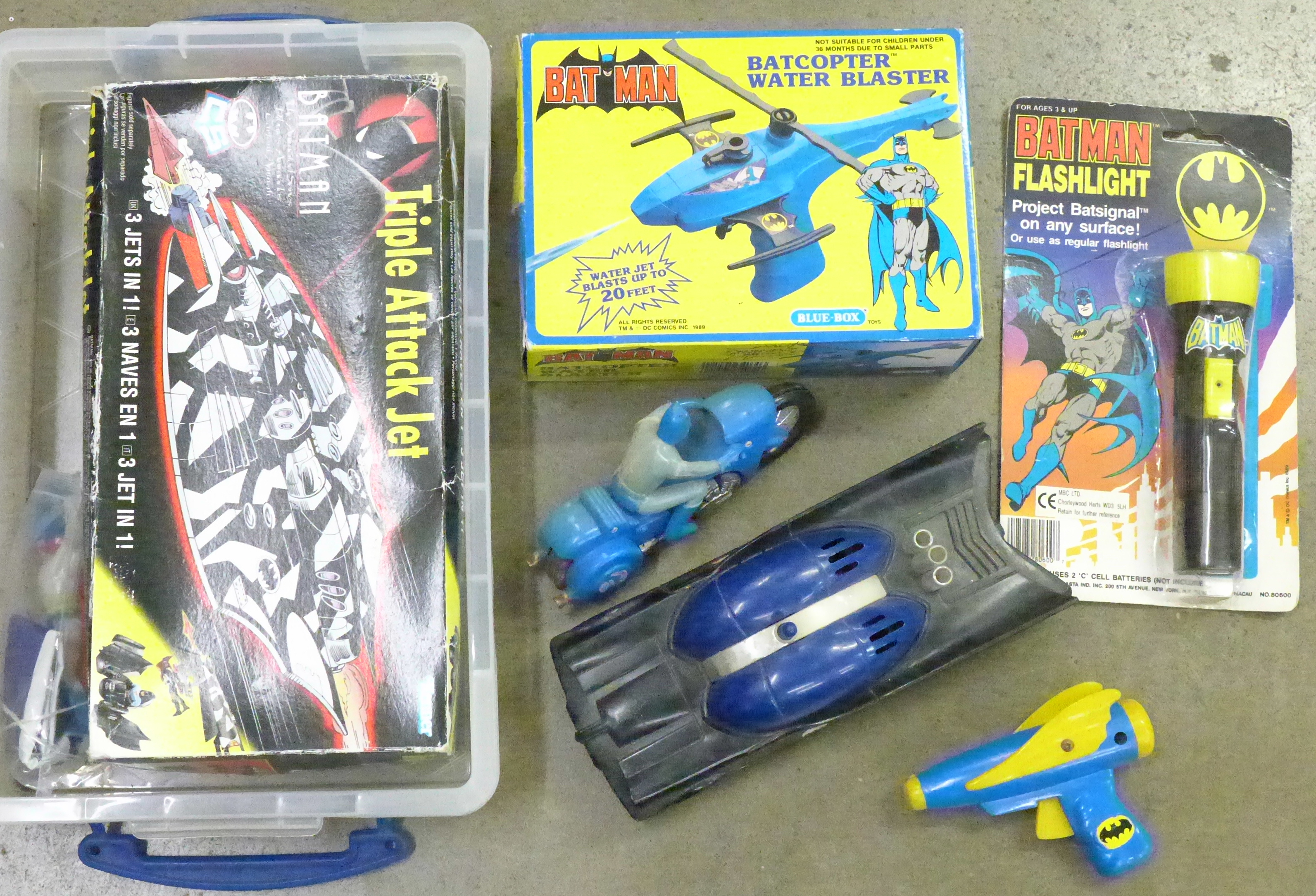 A Batman Waterblaster (unopened box), a toy gun, Batman Triple Attack Jet, boxed, Batman flashlight,