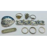 Six silver rings (one 9ct on silver), a Victorian silver brooch and a .