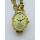 A lady's 9ct gold wristwatch and strap, total weight with movement, 11.