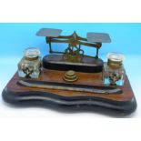 An ink stand with postal scales and weights, width 27cm,