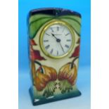 A Moorcroft mantel clock, glass a/f, 15.