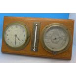 An oak mounted clock, barometer and thermometer, width 29.