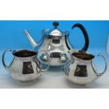 An Elkington three piece plated tea service designed by Eric Clements