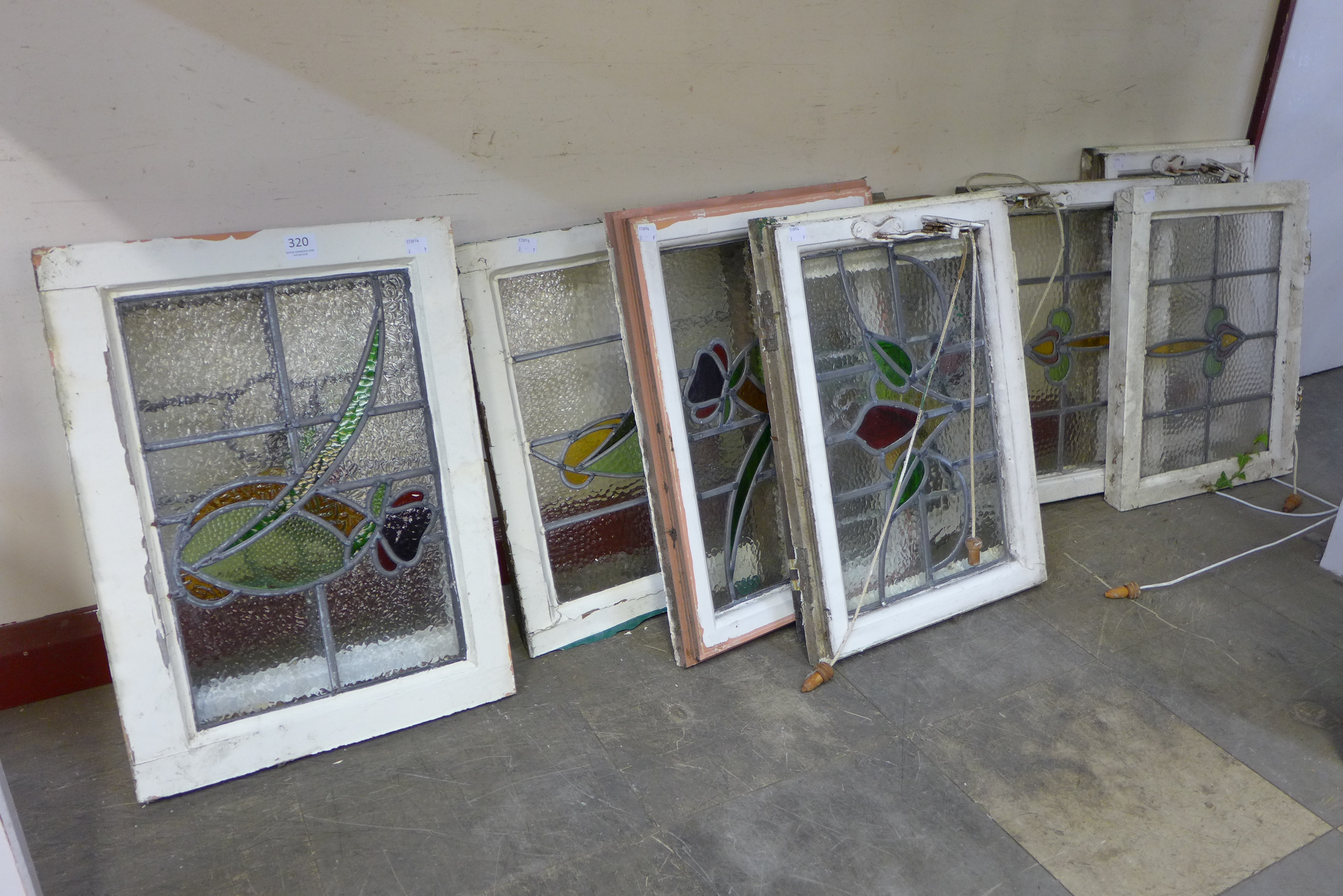 Nine 1920's stained glass windows