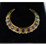 A 9ct gold, ruby and diamond crescent brooch, 2.