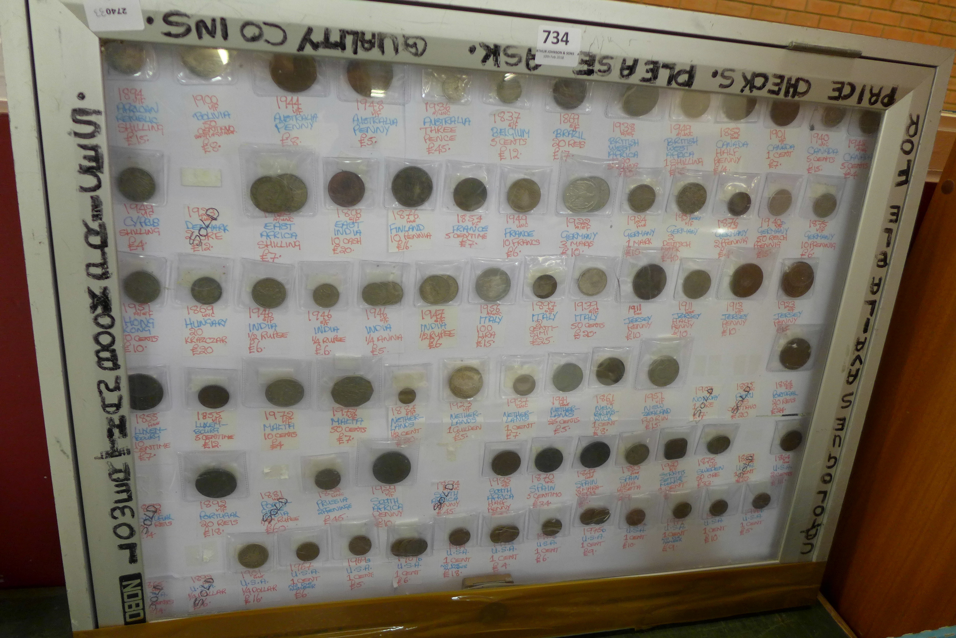 A display cabinet with eighty foreign coins,