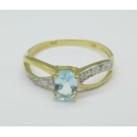 A 9ct gold, topaz and diamond ring, 1g,
