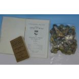 Military buttons and two booklets,