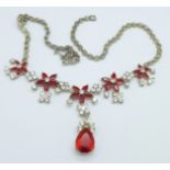 A red and white paste necklace