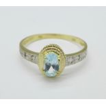 A 9ct gold, topaz and diamond ring, 1.