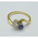 An 18ct gold, diamond and blue stone ring, 3g,