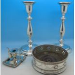 A pair of plated candlesticks,