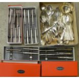 A collection of plated cutlery including boxed Walker & Hall knives and a large ladle