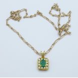An 18ct gold, white stone and emerald pendant and a 9ct gold chain, 5.3g, (2.1g + 3.