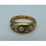 A 9ct gold and three stone opal ring, Birmingham 1901, 1.