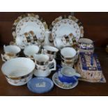 A twelve setting decorative tea service, twelve cups (one a/f), saucers, side plates,