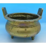 A brass three footed bowl, six character mark on base, diameter 14.