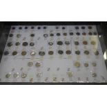 A large display cabinet with seventy-three British coins,