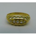 An 18ct gold, five stone diamond ring, 2.